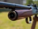 Shot of a classic 32WIN Winchester rifle emphasizing its craftsmanship and historical appeal, perfect for firearm enthusiasts and collectors.