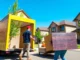 Professional Calgary relocation services team safely moving furniture in a sunny city neighborhood, ensuring stress-free transitions.