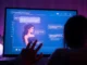 Close-up of a digital chat interface with animated AI characters in a neon-lit room, creating an intimate, futuristic vibe.