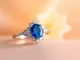 Close-up of a stunning engagement ring with sapphire, showcasing vibrant blue gemstone and shimmering diamonds, highlighting craftsmanship and elegance for proposals.
